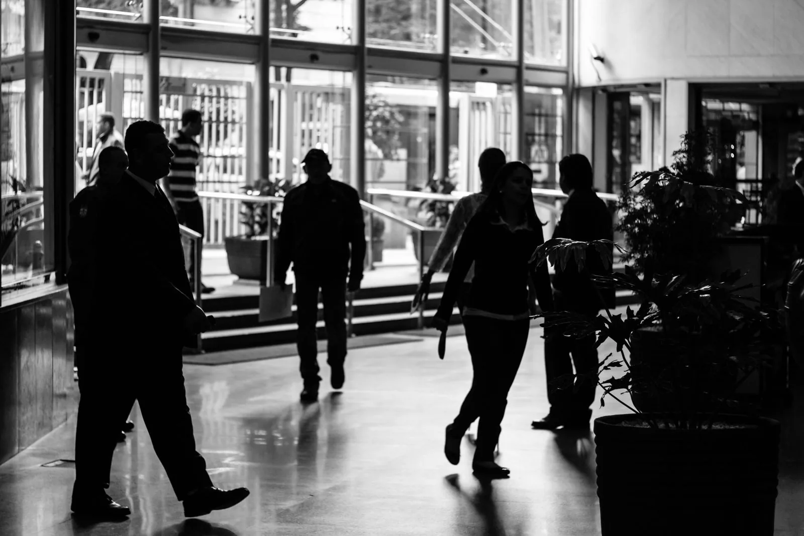 Crowd of people moving through an entrance